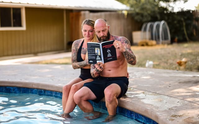 Cass and Kathryn Morrow reading by the pool