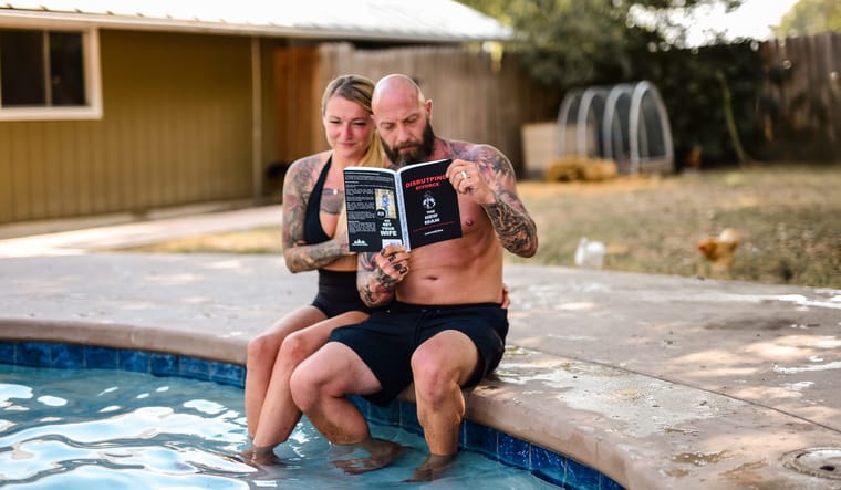 Cass and Kathryn Morrow reading by the pool